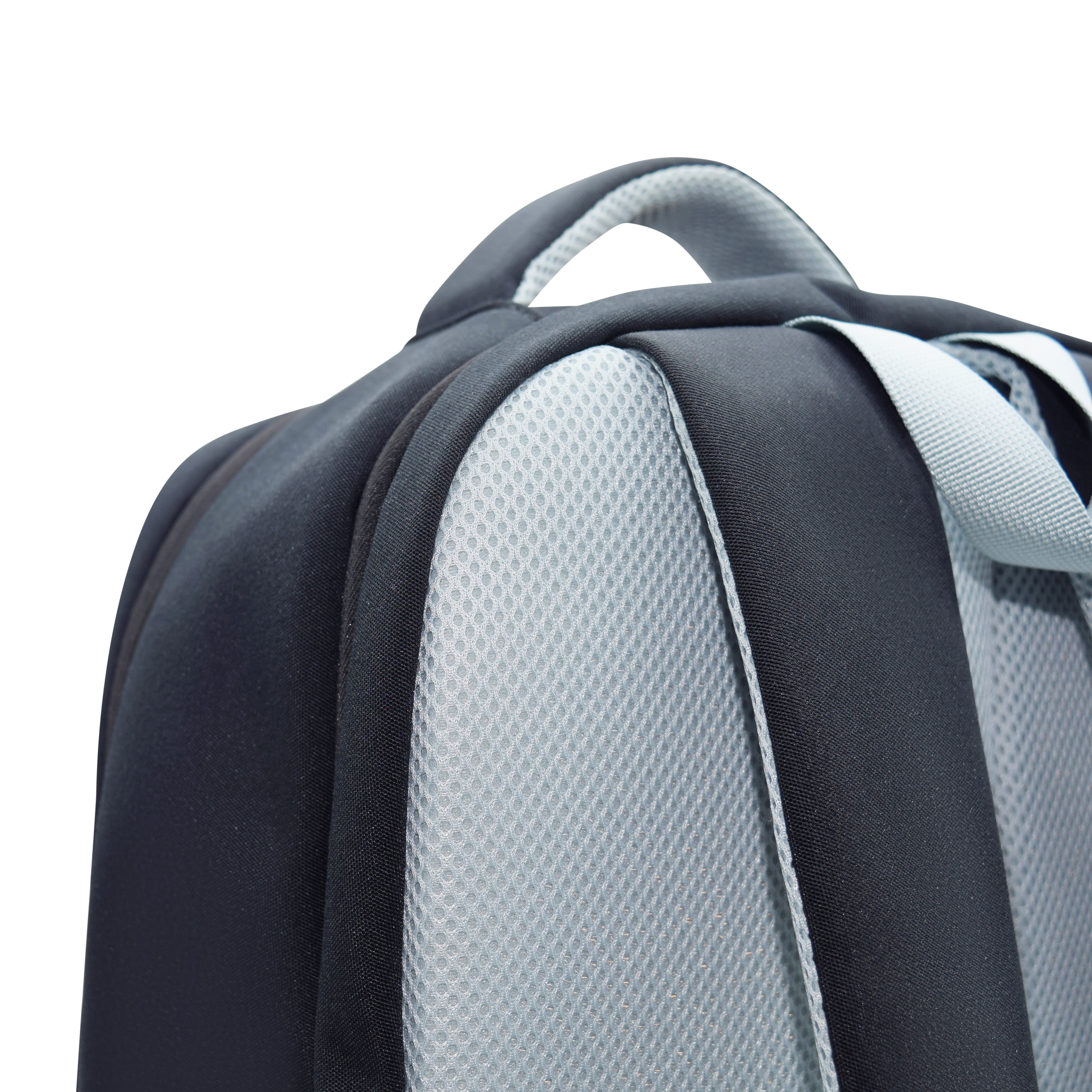 Close-up of a backpack with gray and black straps on a white background